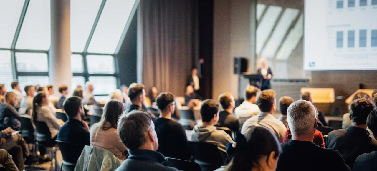 Audience attending a business presentation